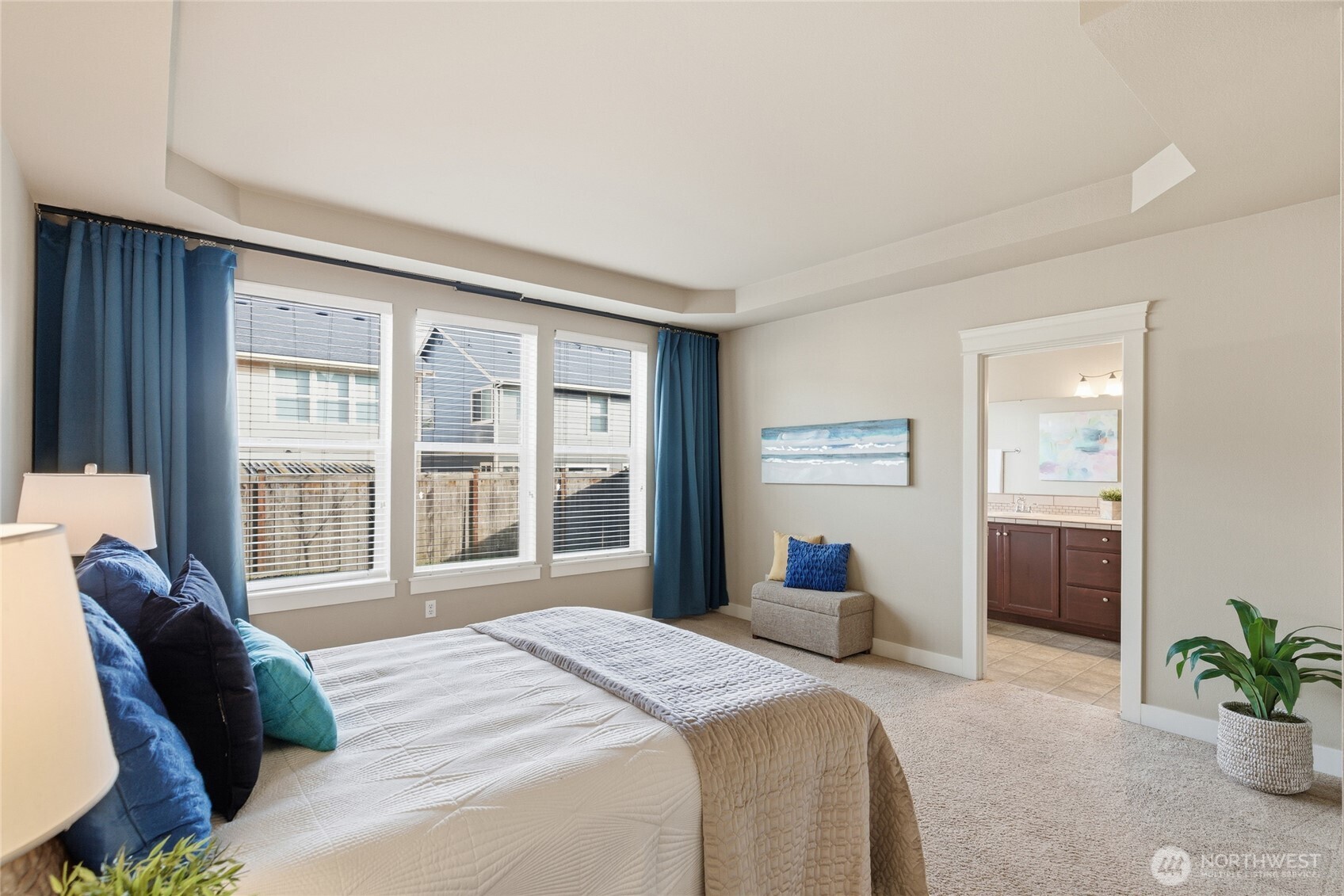 4510 McKinley Street Northeast Lacey, WA 98516 - Photo 14 of 34 a bedroom with a bed and a large window