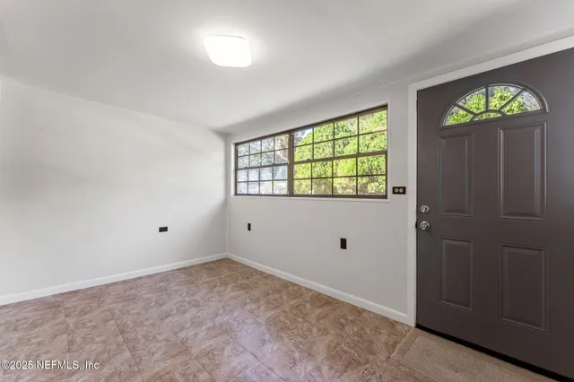 an empty room with windows