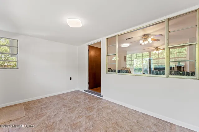 a view of an empty room with a window