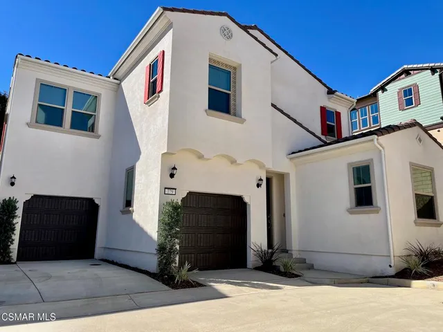a front view of a house with a large windows