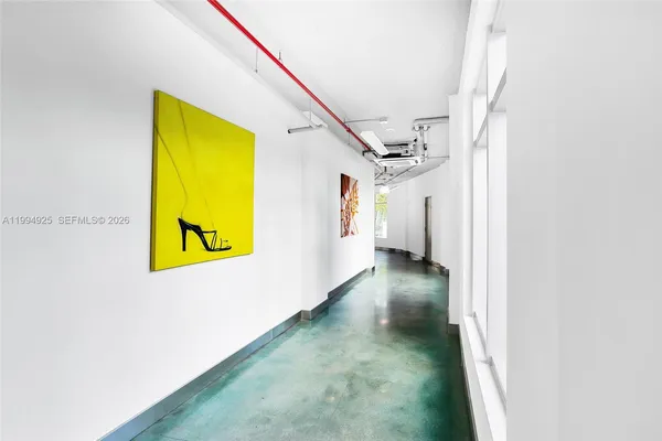 a view of a hallway with painted walls