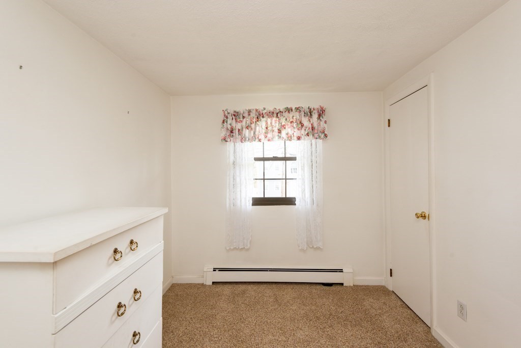 78 Renwick Road, Unit B Wakefield, MA 01880 - Photo 24 of 35 a room with a window and a ceiling fan