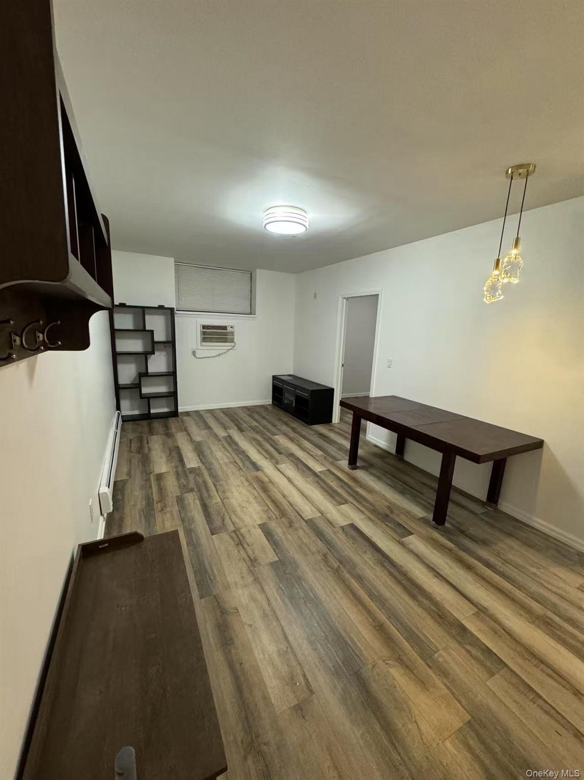 38-08 147th Street, Unit C2 Queens, NY 11357 - Photo 2 of 12 a bedroom with a bed and a dresser