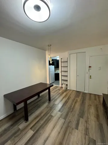 a room with wooden floor and window