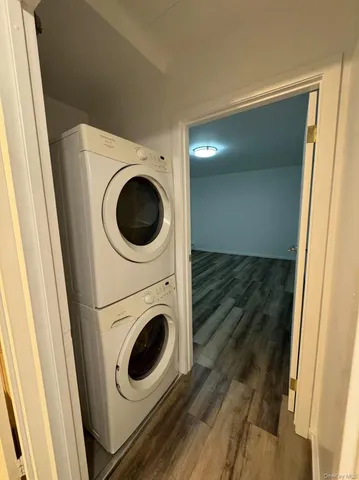 a view of a hallway with washer and dryer
