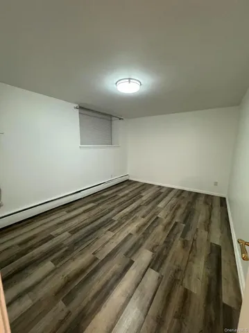 en empty room with wooden floor