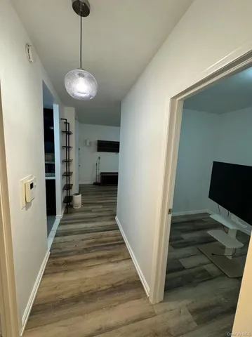a view of a hallway to a livingroom