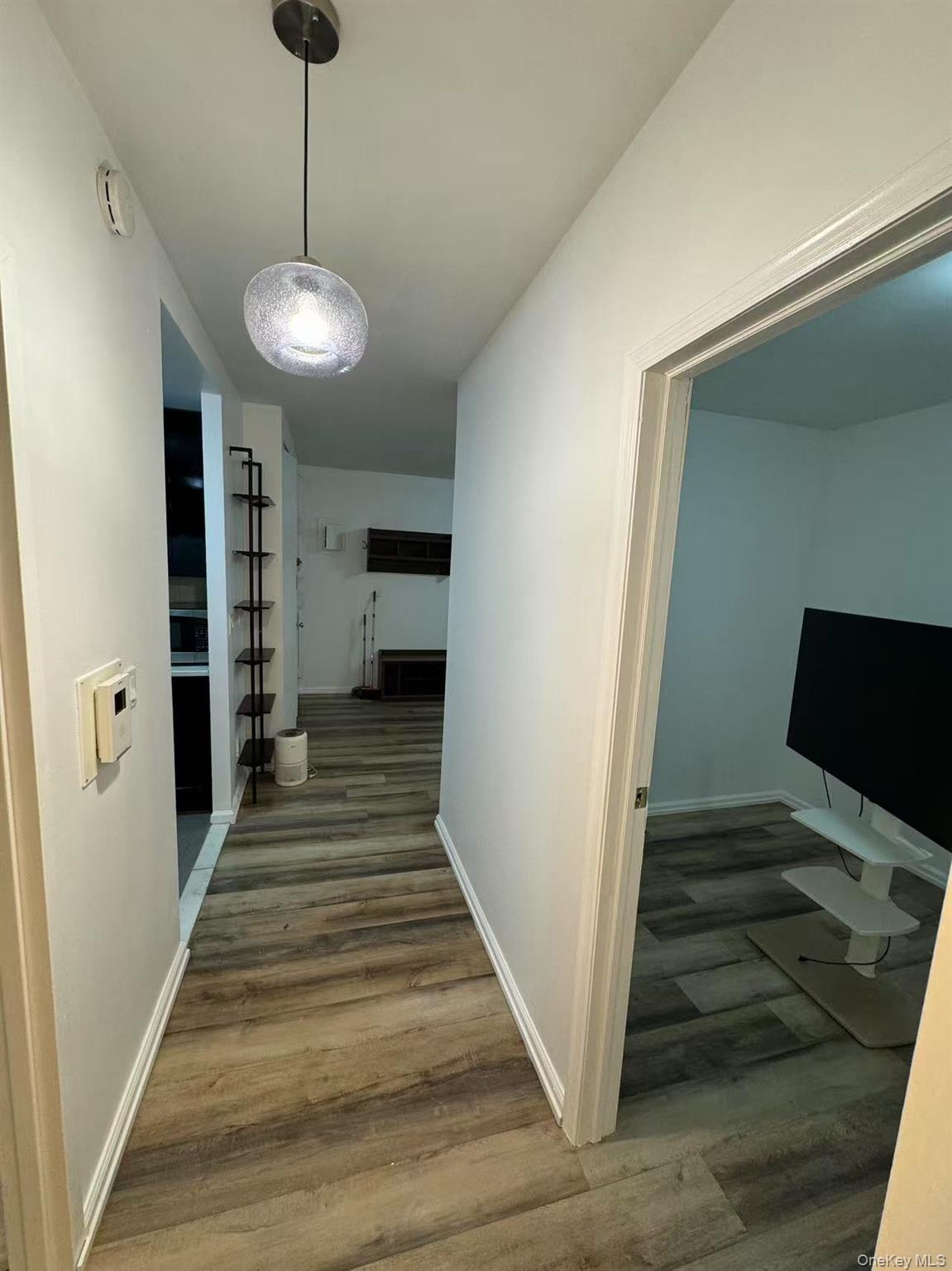 38-08 147th Street, Unit C2 Queens, NY 11357 - Photo 10 of 12 a view of a hallway to a livingroom