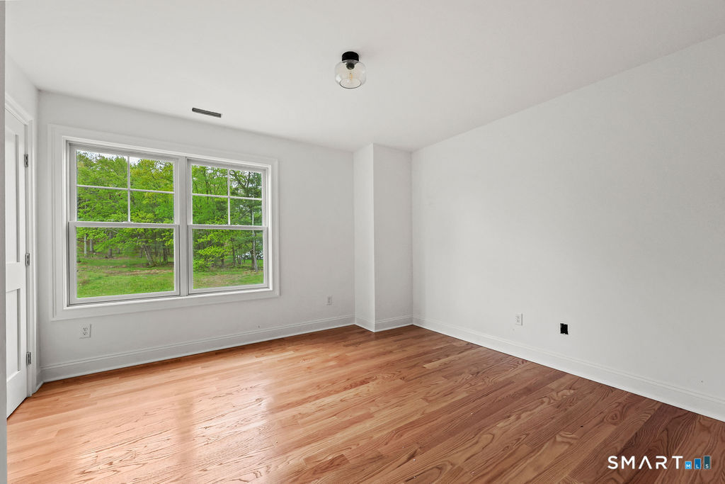 8 Ridgewood Club Road Prospect, CT 06712 - Photo 23 of 40 an empty room with a window