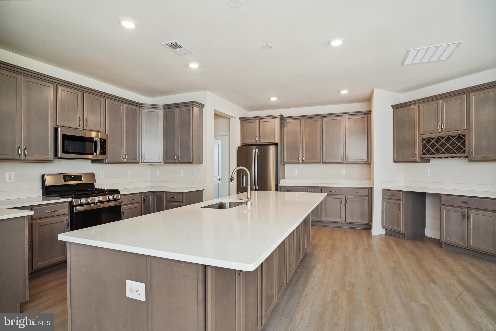 19 Cardinal Flower Way Gettysburg, PA 17325 - Photo 11 of 34 a kitchen with a center island appliances and cabinets