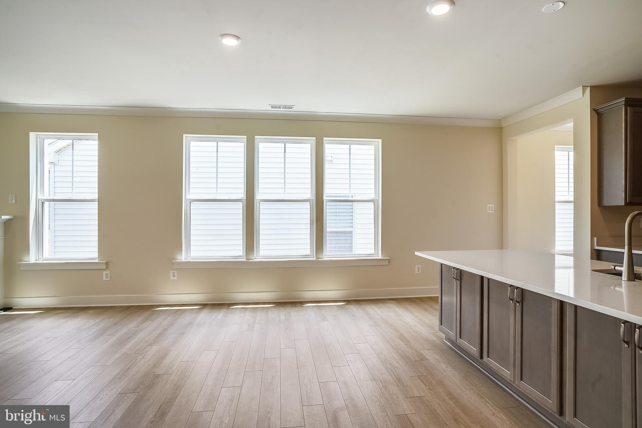19 Cardinal Flower Way Gettysburg, PA 17325 - Photo 14 of 34 an empty room with wooden floor and windows
