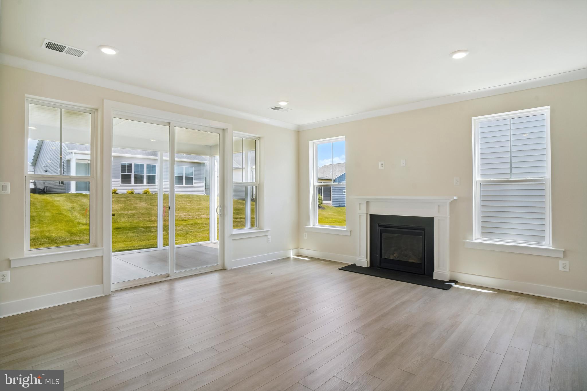 19 Cardinal Flower Way Gettysburg, PA 17325 - Photo 15 of 34 an empty room with wooden floor and fireplace