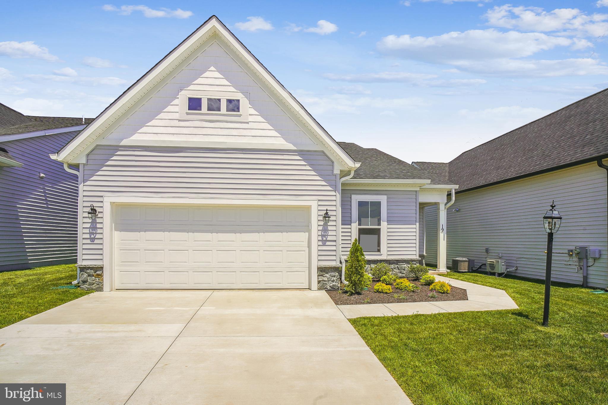 19 Cardinal Flower Way Gettysburg, PA 17325 - Photo 2 of 34 a front view of a house with a yard