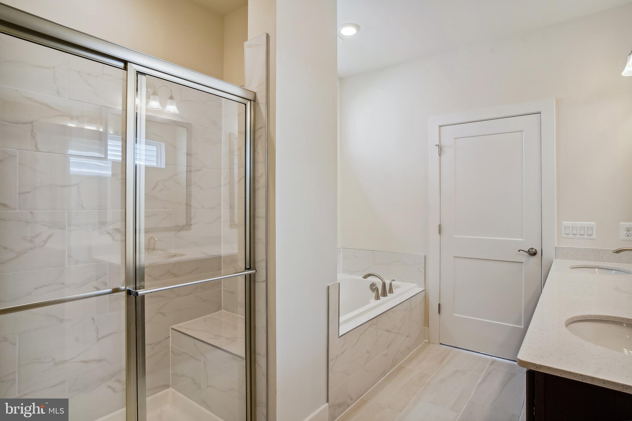 19 Cardinal Flower Way Gettysburg, PA 17325 - Photo 21 of 34 a bathroom with a bathtub and a shower