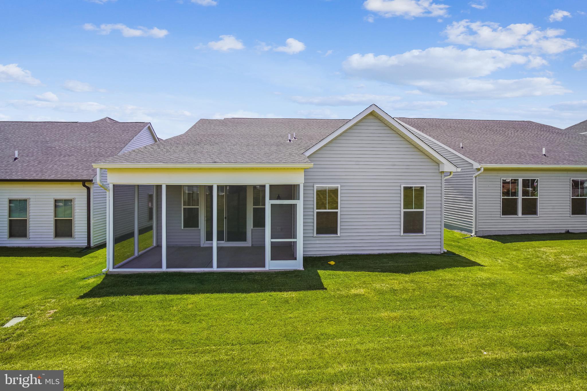 19 Cardinal Flower Way Gettysburg, PA 17325 - Photo 29 of 34 a view of a house with a yard potted plants and a table