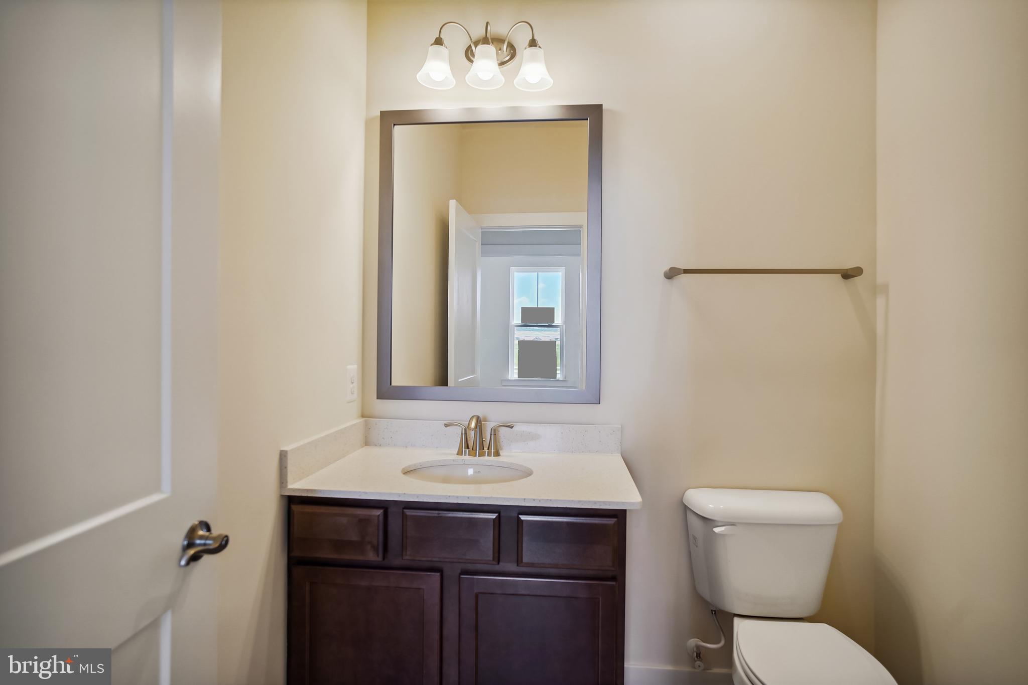 19 Cardinal Flower Way Gettysburg, PA 17325 - Photo 6 of 34 a bathroom with a sink mirror toilet and vanity