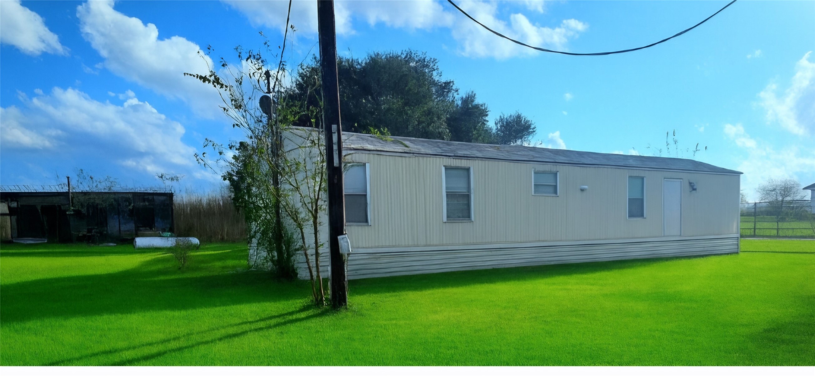 a backyard of a house with lots of green space