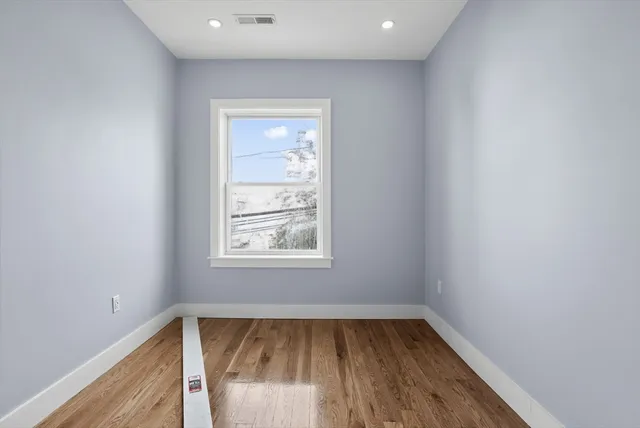 a kitchen with stainless steel appliances granite countertop a sink a stove and cabinets