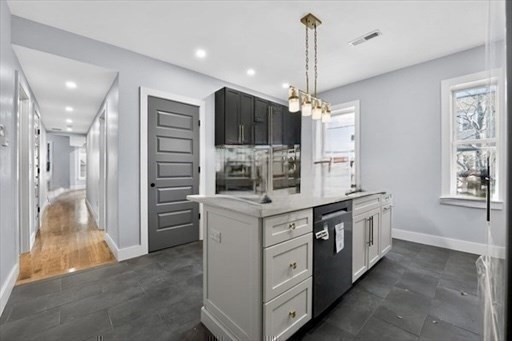 31 Homestead Street, Unit 2 Boston, MA 02121 - Photo 15 of 23 a kitchen with stainless steel appliances granite countertop a stove and a refrigerator