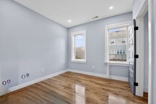 31 Homestead Street, Unit 2 Boston, MA 02121 - Photo 17 of 23 a view of empty room with wooden floor and fan