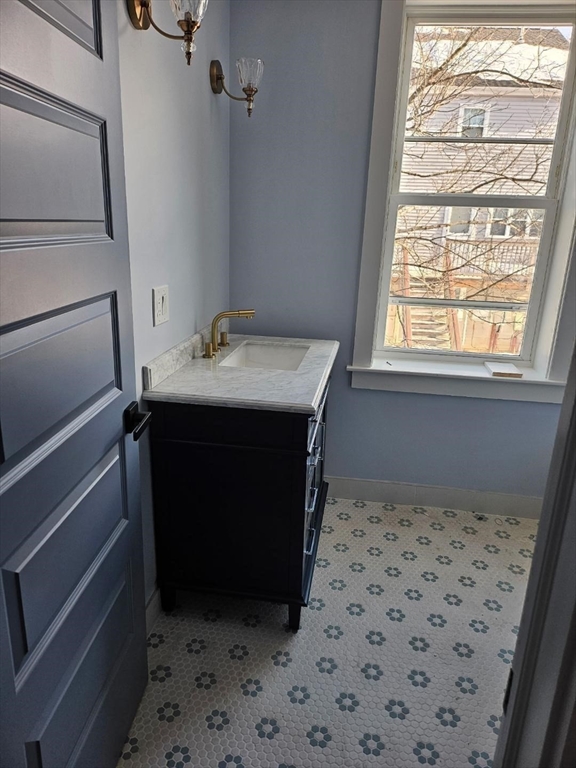 31 Homestead Street, Unit 2 Boston, MA 02121 - Photo 20 of 23 a bathroom with a sink a vanity and a shower
