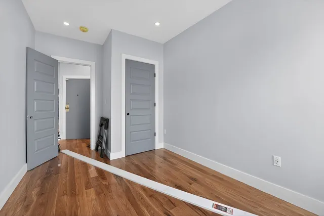 a bedroom with a bed and a walk in closet