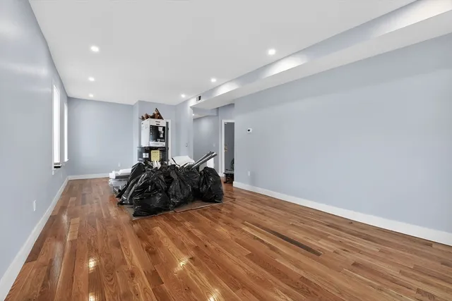 a view of a room with wooden shelves
