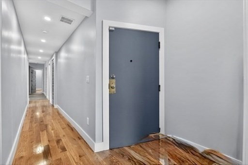 31 Homestead Street, Unit 2 Boston, MA 02121 - Photo 9 of 23 a view of hallway with wooden floor