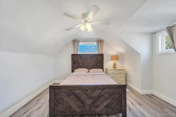 a room with a bed and a chandelier