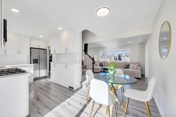 a living room with fireplace furniture and a wooden floor