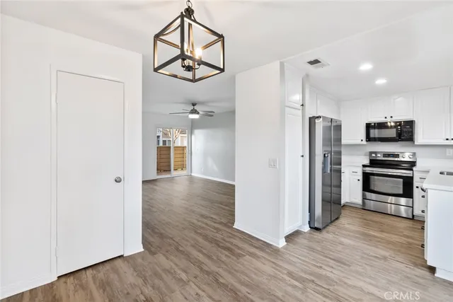 a view of a kitchen from the hallway