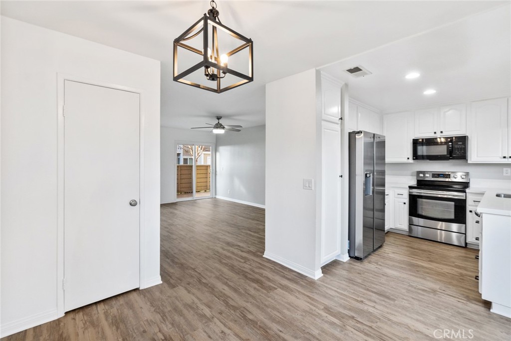 a view of a kitchen from the hallway