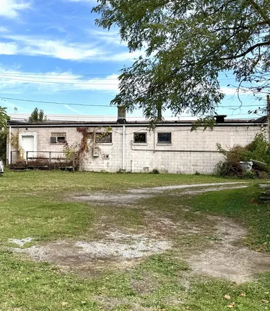 a view of house with yard