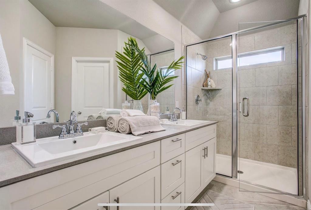 4432 Thalia Way Forney, TX 75126 - Photo 14 of 16 a bathroom with a sink and mirror