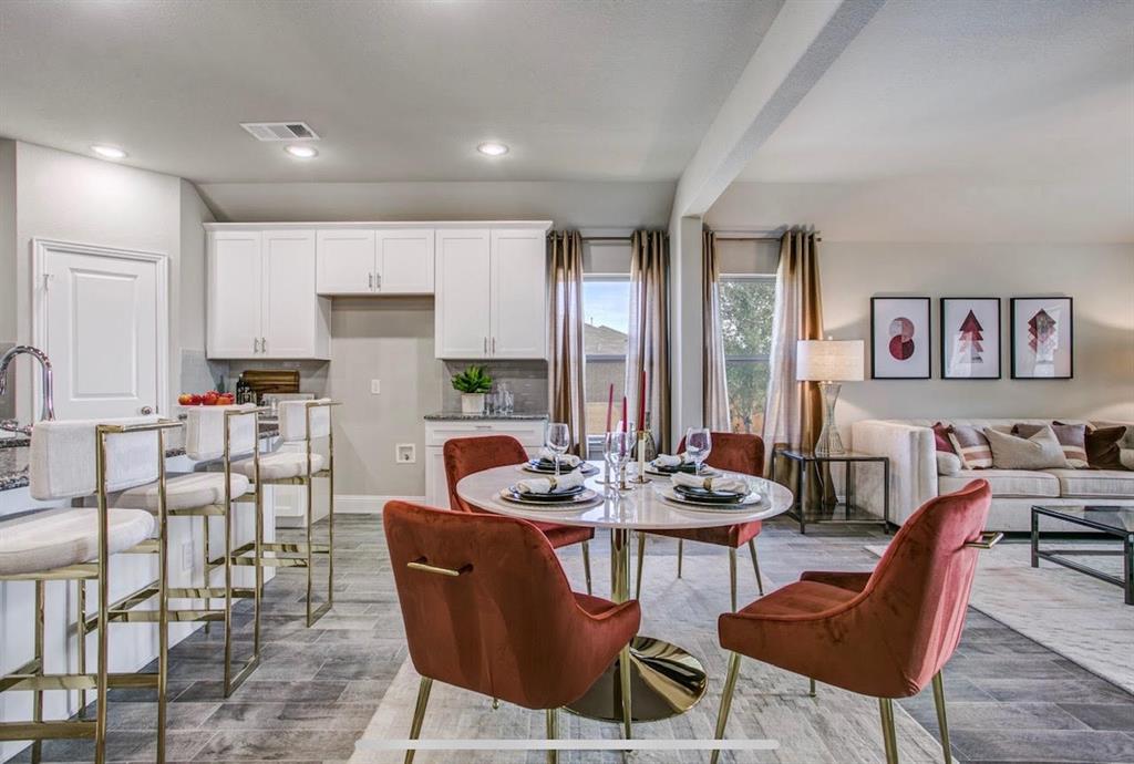 4432 Thalia Way Forney, TX 75126 - Photo 7 of 16 a dining room with furniture and a large window