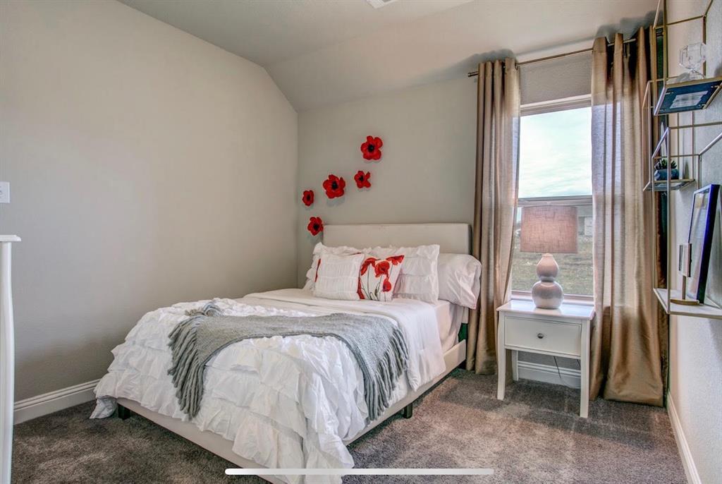 4432 Thalia Way Forney, TX 75126 - Photo 10 of 16 a bedroom with a bed and a window