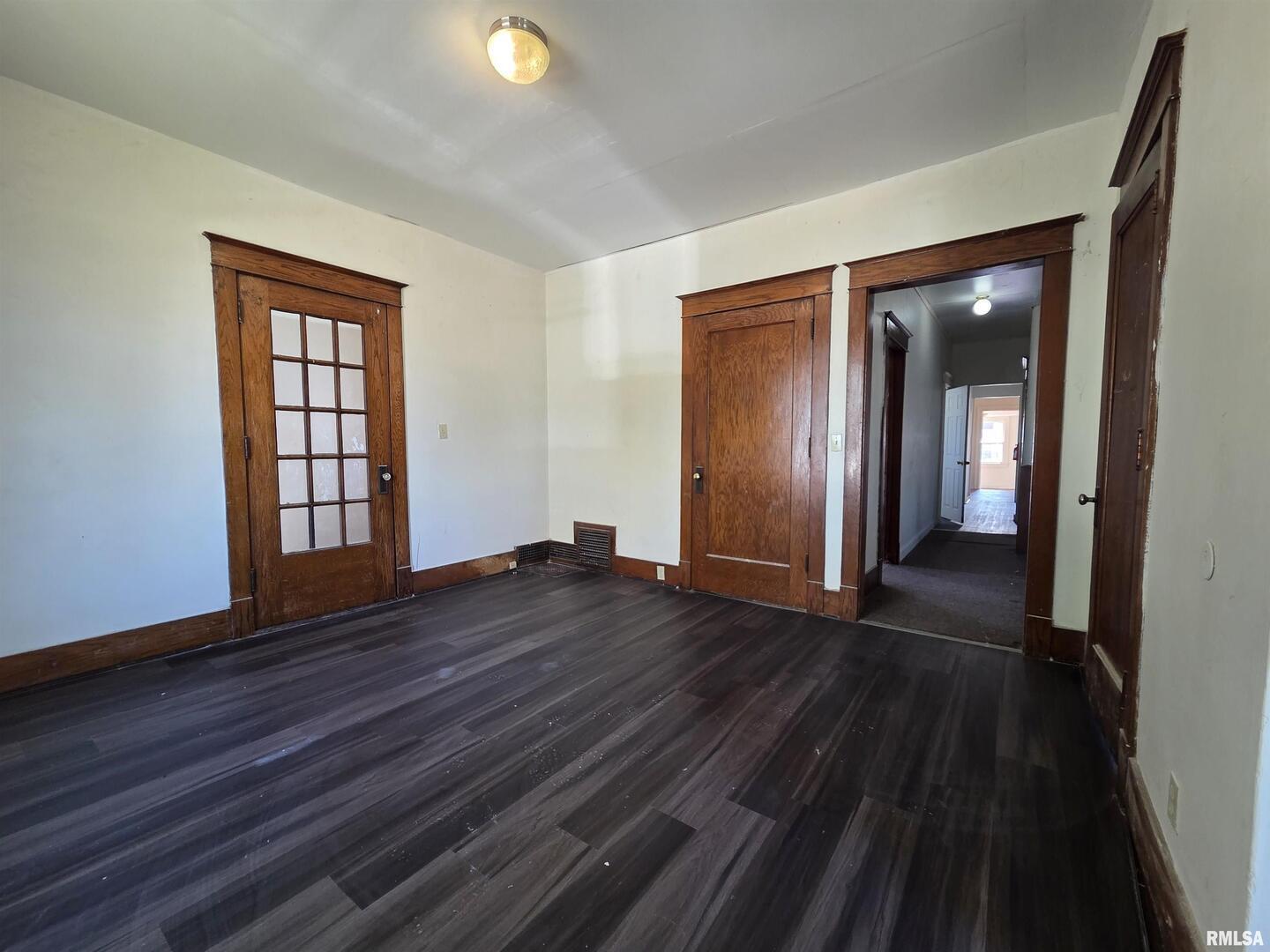 519 4th Avenue South Clinton, IA 52732 - Photo 6 of 16 wooden floor in an empty room with a window