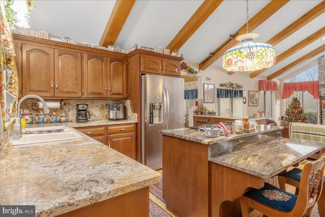 a living room with granite countertop furniture and a fireplace