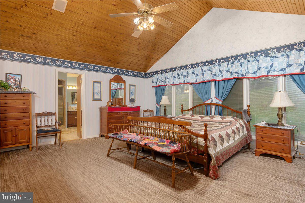 19850 Cool Hollow Road Hagerstown, MD 21740 - Photo 23 of 63 a bed room with a bed and a chair
