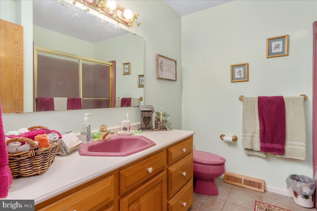 19850 Cool Hollow Road Hagerstown, MD 21740 - Photo 31 of 63 a bathroom with a sink mirror and toilet