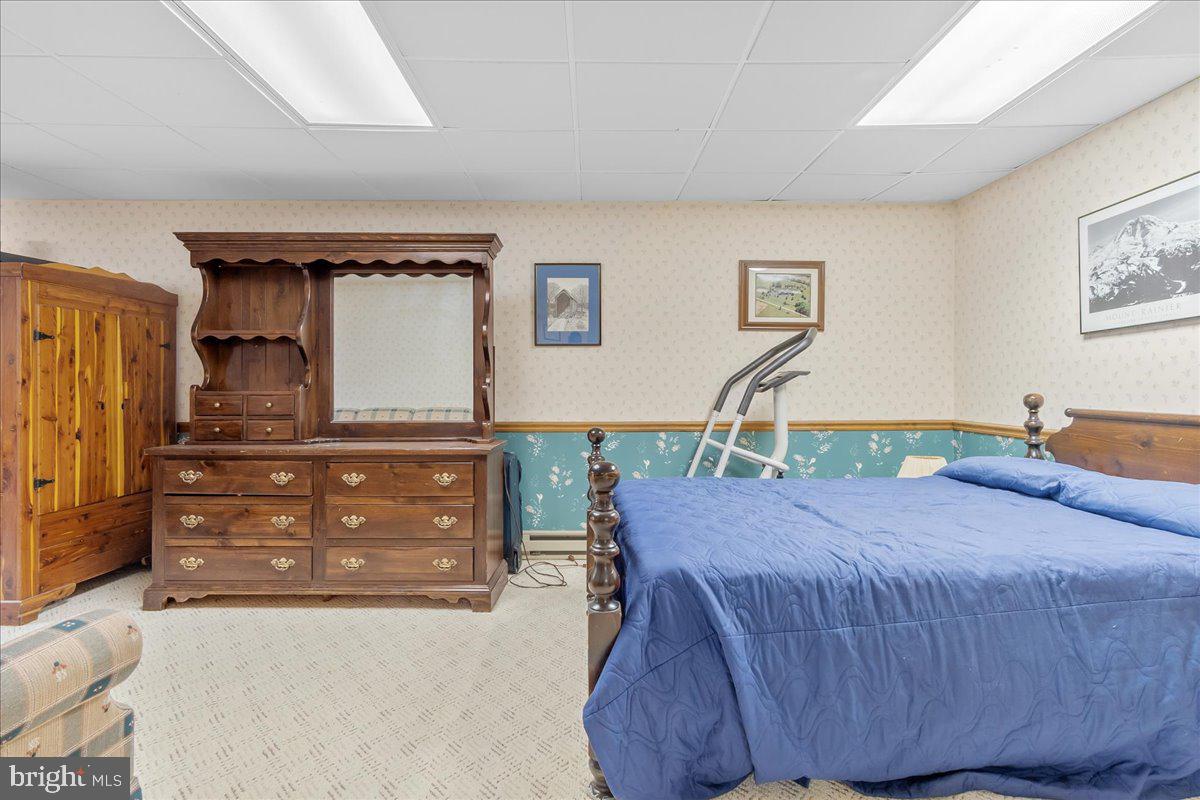 19850 Cool Hollow Road Hagerstown, MD 21740 - Photo 39 of 63 a bedroom with a bed and a dresser