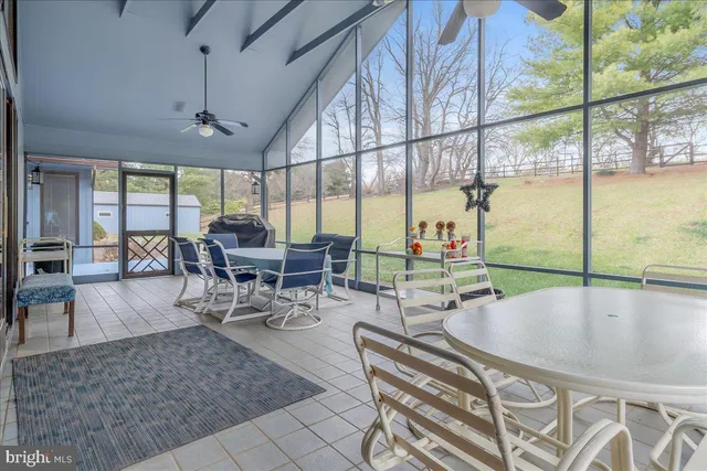 a view of a swimming pool with an outdoor space and seating area