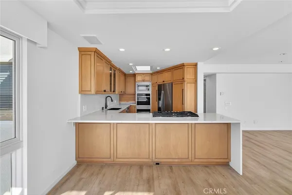 a view of kitchen with wooden floor