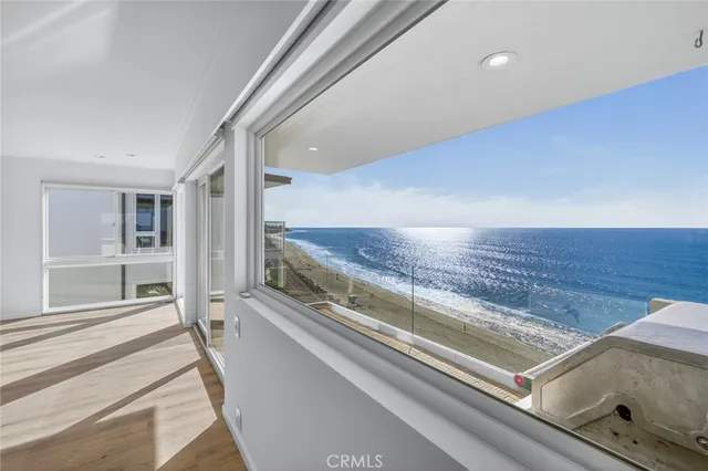a view of a kitchen with wooden floor and a kitchen