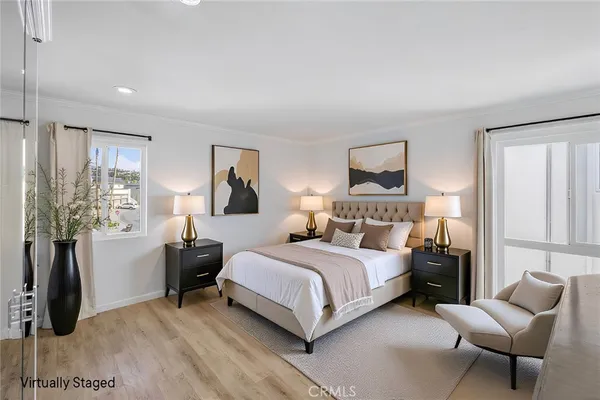 a bedroom with a bed and a couch