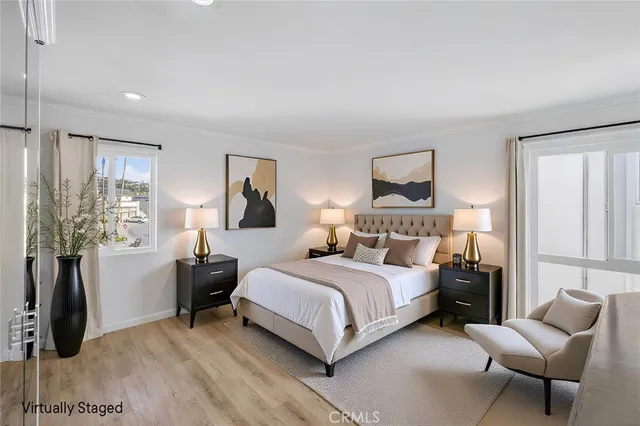 an empty room with wooden floor and cabinet