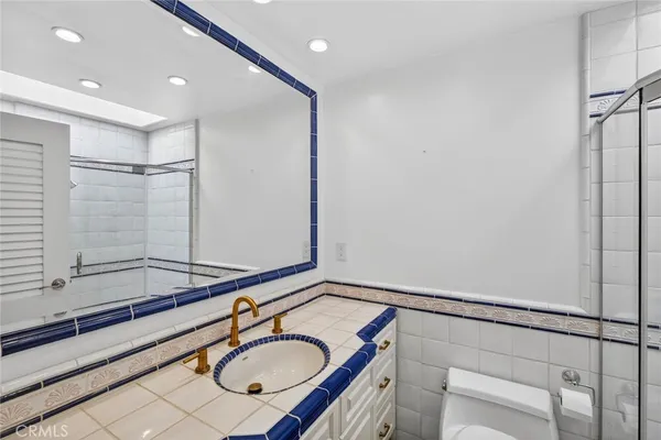 a bathroom with a sink double vanity and a mirror