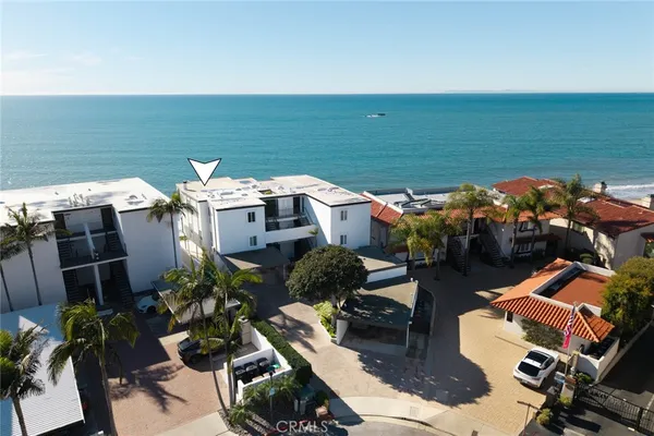 an aerial view of a house with a ocean view