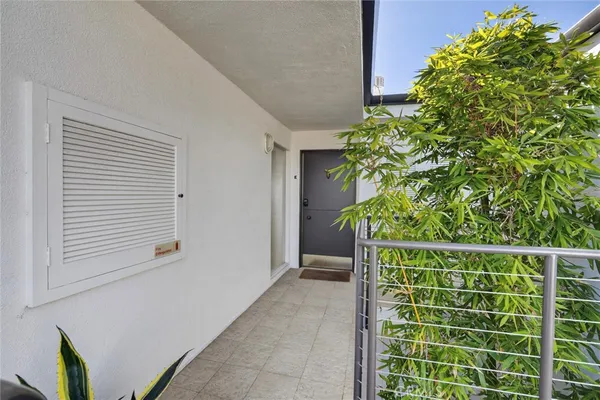 a house with a plant in front of it