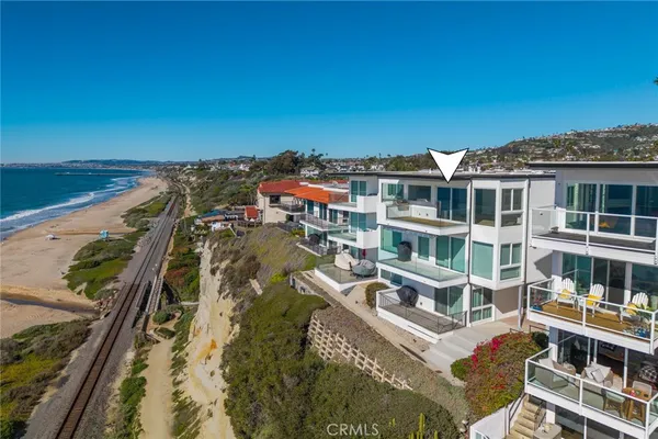 a view of buildings with ocean view